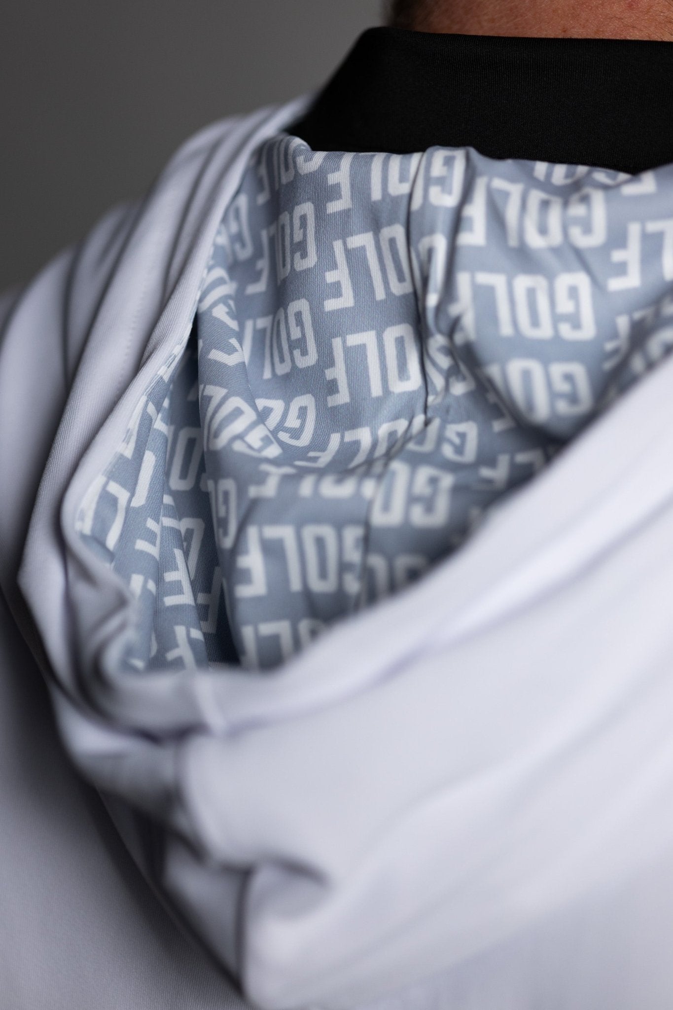 Close-up of the hood interior lining with bold white text pattern on the GOLF Whiteout Athletic Hoodie