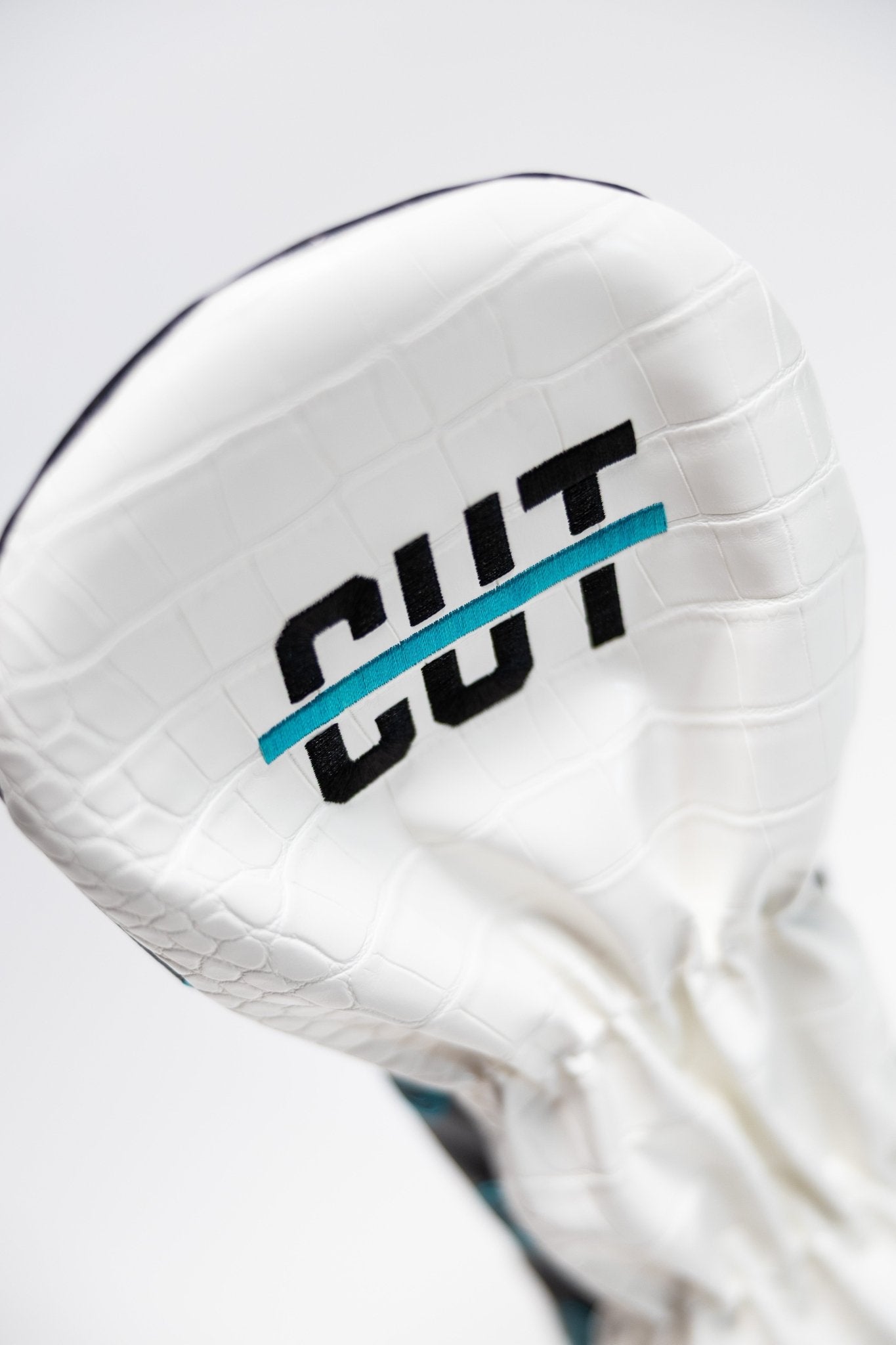White faux-crocodile golf headcover with Cutline logo detail on the Teal Gator Scorecard Driver Cover