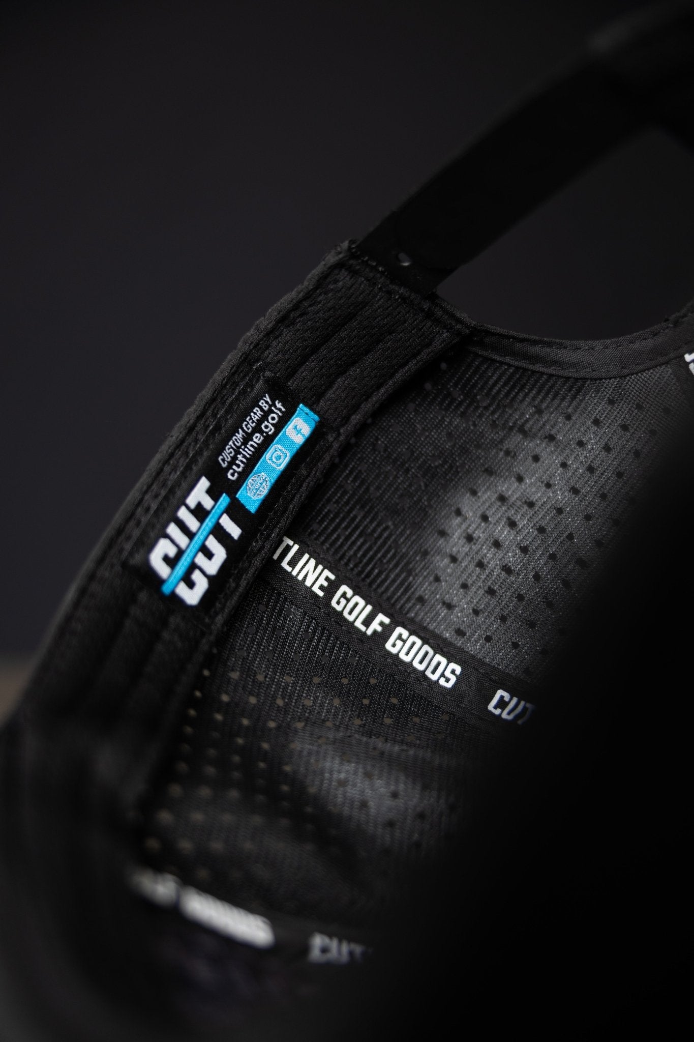 Close-up of the black interior label and lining of the Blackout Cutline Hat from Cutline Golf Goods