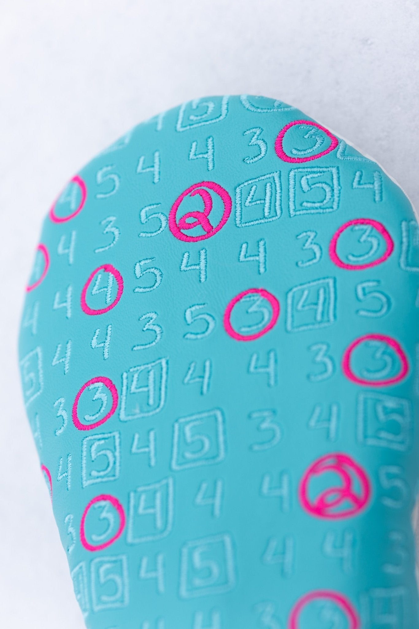 Scorecard Teal Fairway Cover with teal background and pink golf scorecard numbers embroidered design