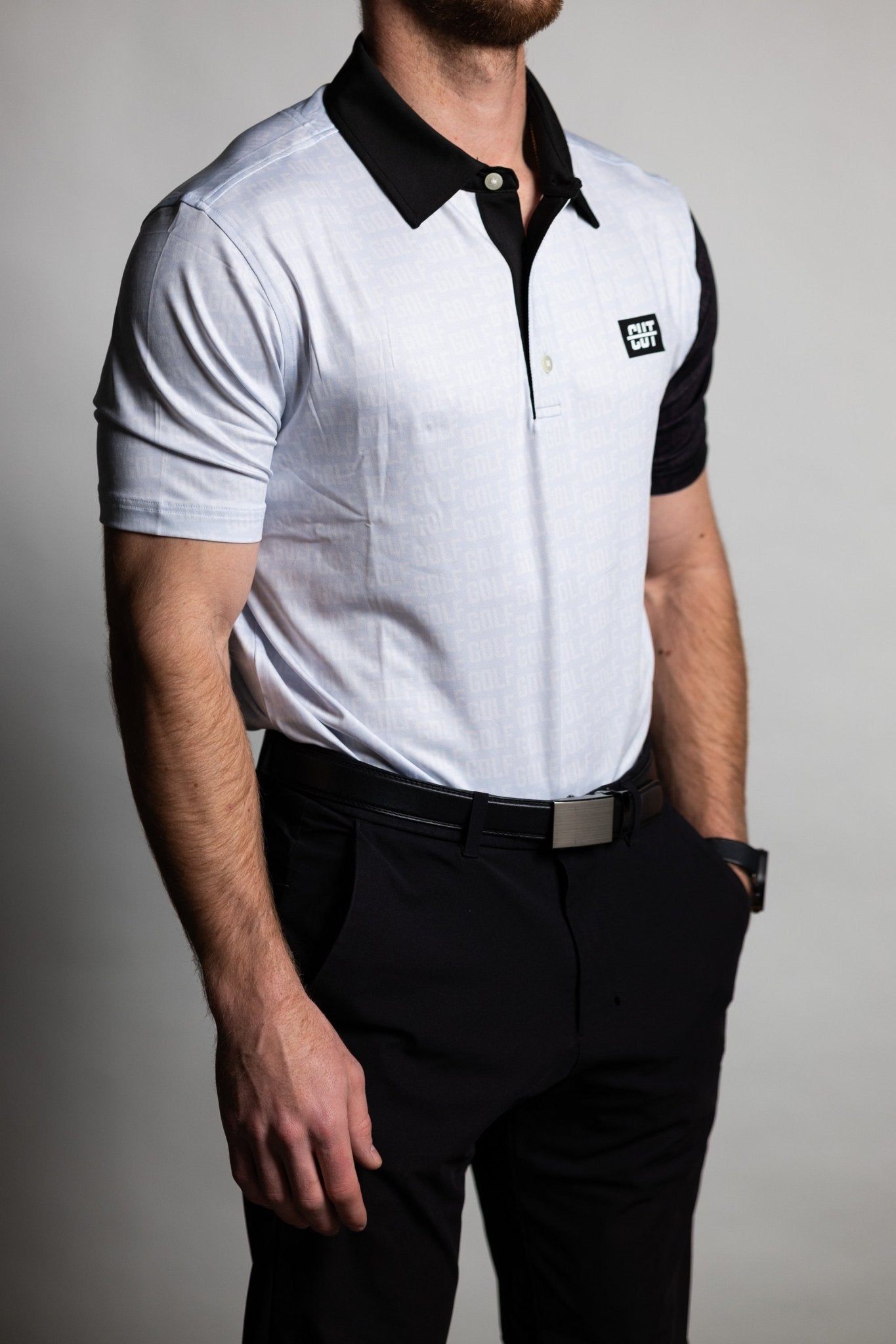 Man wearing GOLF Pattern Off White Polo with black collar and sleeves, styled with black pants and belt
