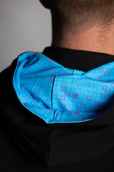 Close-up of the teal patterned inner lining of the Teal Scorecard Athletic Hoodie on a model's back.