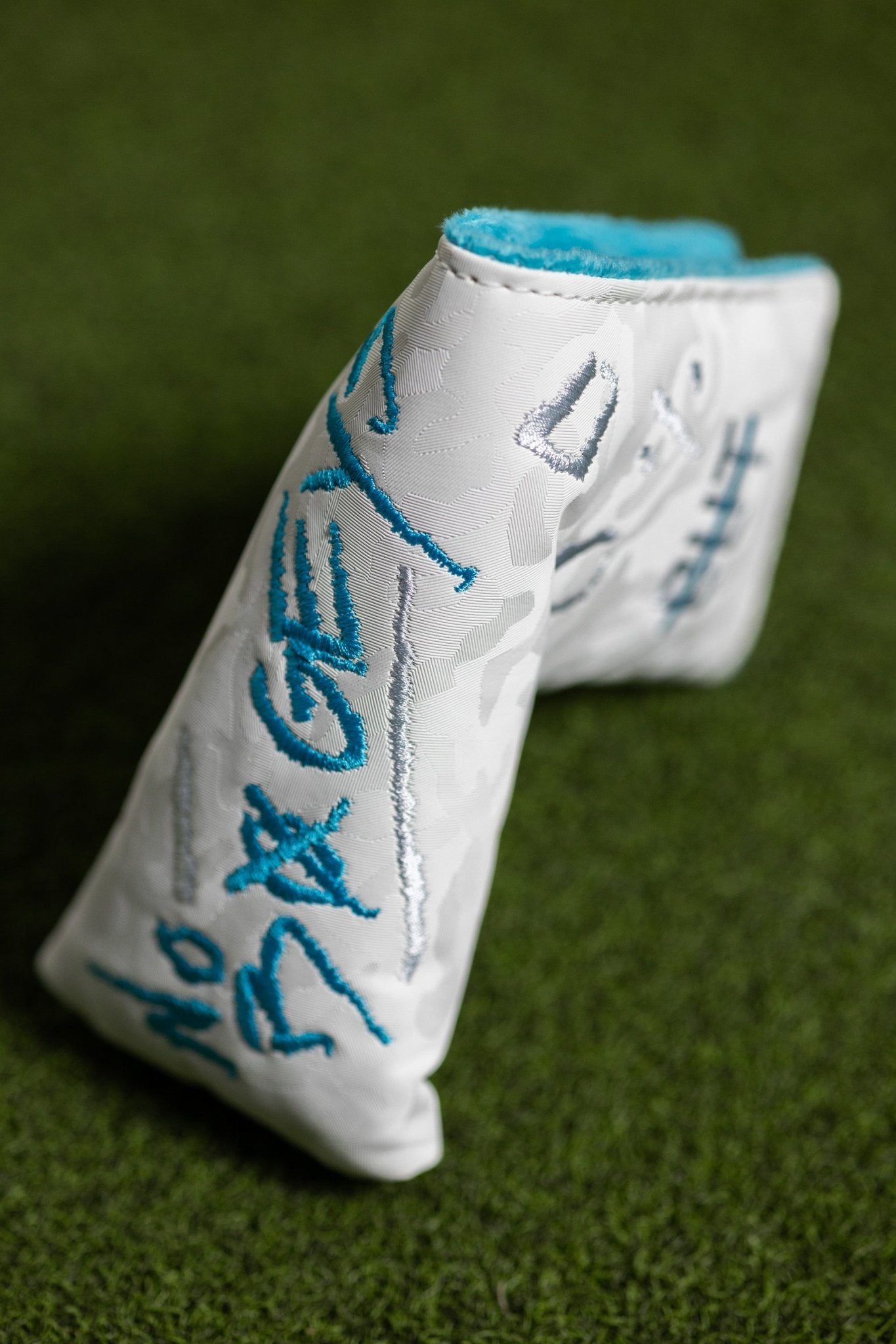 No Bogeys White Blade Cover with blue embroidered lettering on textured white golf headcover background.