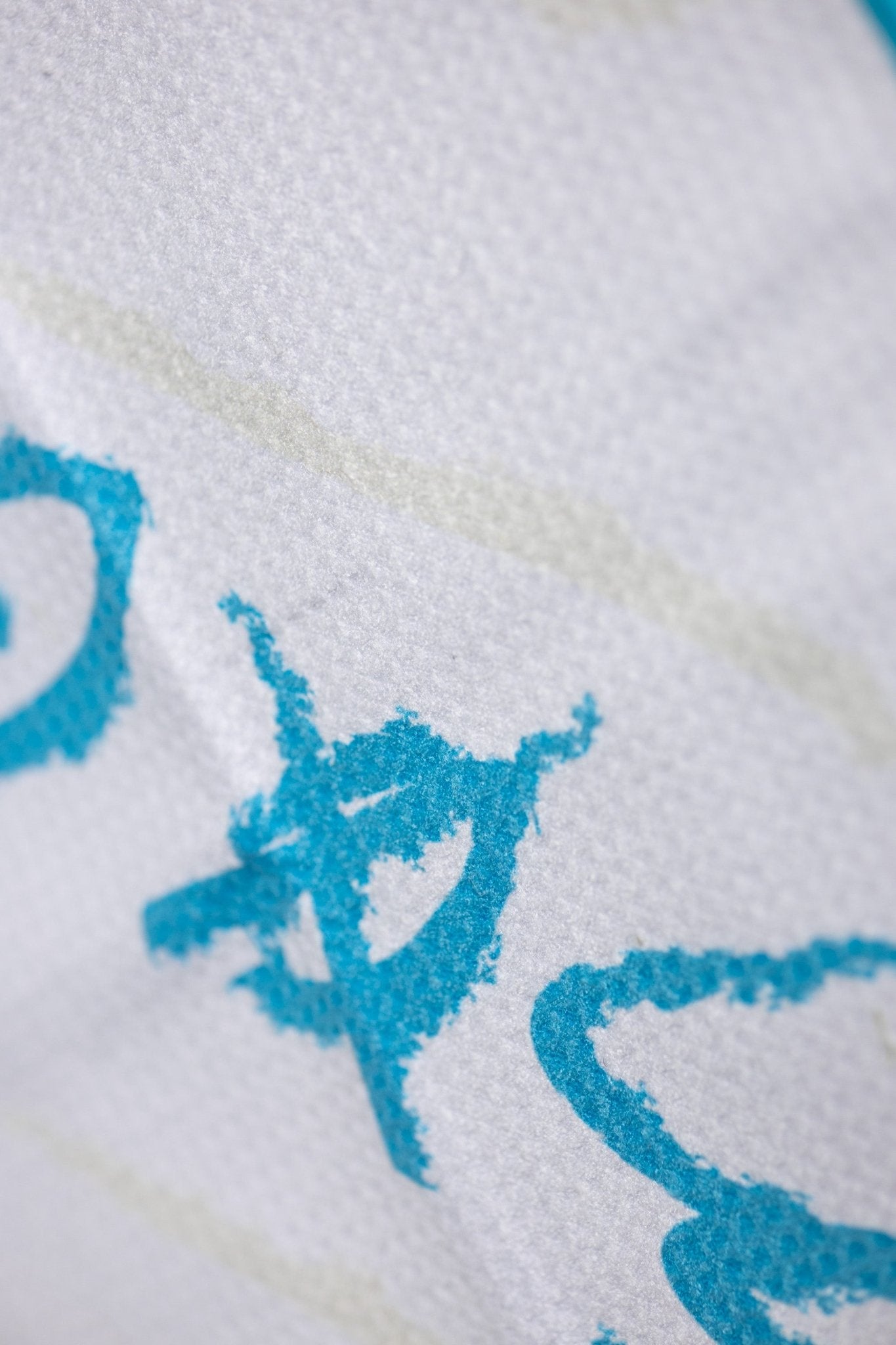 Close-up of textured fabric with turquoise print detail on the No Bogeys Oversized Towel