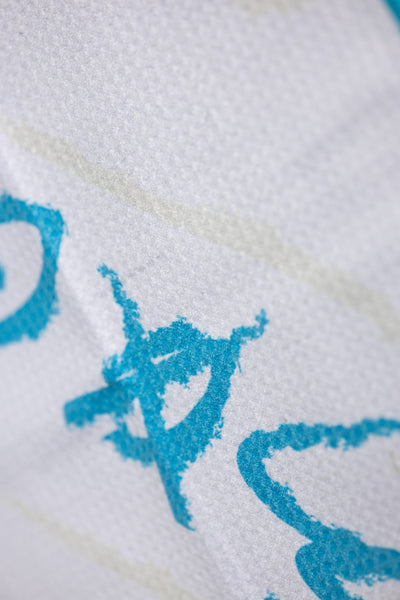 Close-up of textured fabric with turquoise print detail on the No Bogeys Oversized Towel