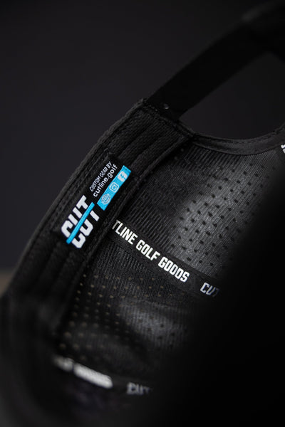 Close-up of the black interior label and lining of the Blackout Cutline Hat from Cutline Golf Goods