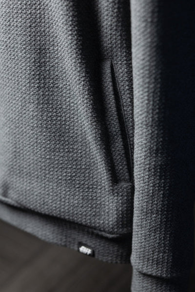 Close-up of waffle knit texture and pocket detail on Waffle Knit Cobalt Grey GOLF Hoodie, casual golf apparel piece.