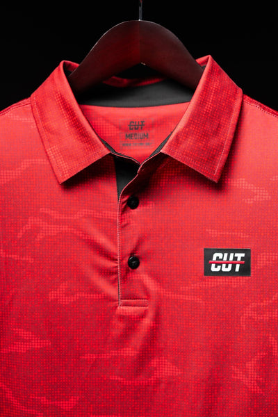 True Red Tech Camo Polo with subtle camouflage pattern, black buttons, and CUT logo on chest in golf apparel style